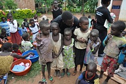 Man hugging children Kampala, Uganda, Africa