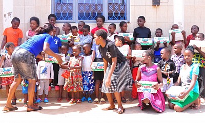 Donations of dry milk are being given to destitute families in Kampala Uganda Africa