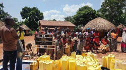 A special day. Tonny Mwesigwa talks to the Mayuge Village and dedicates the 60th well he has given to his neighboring communities